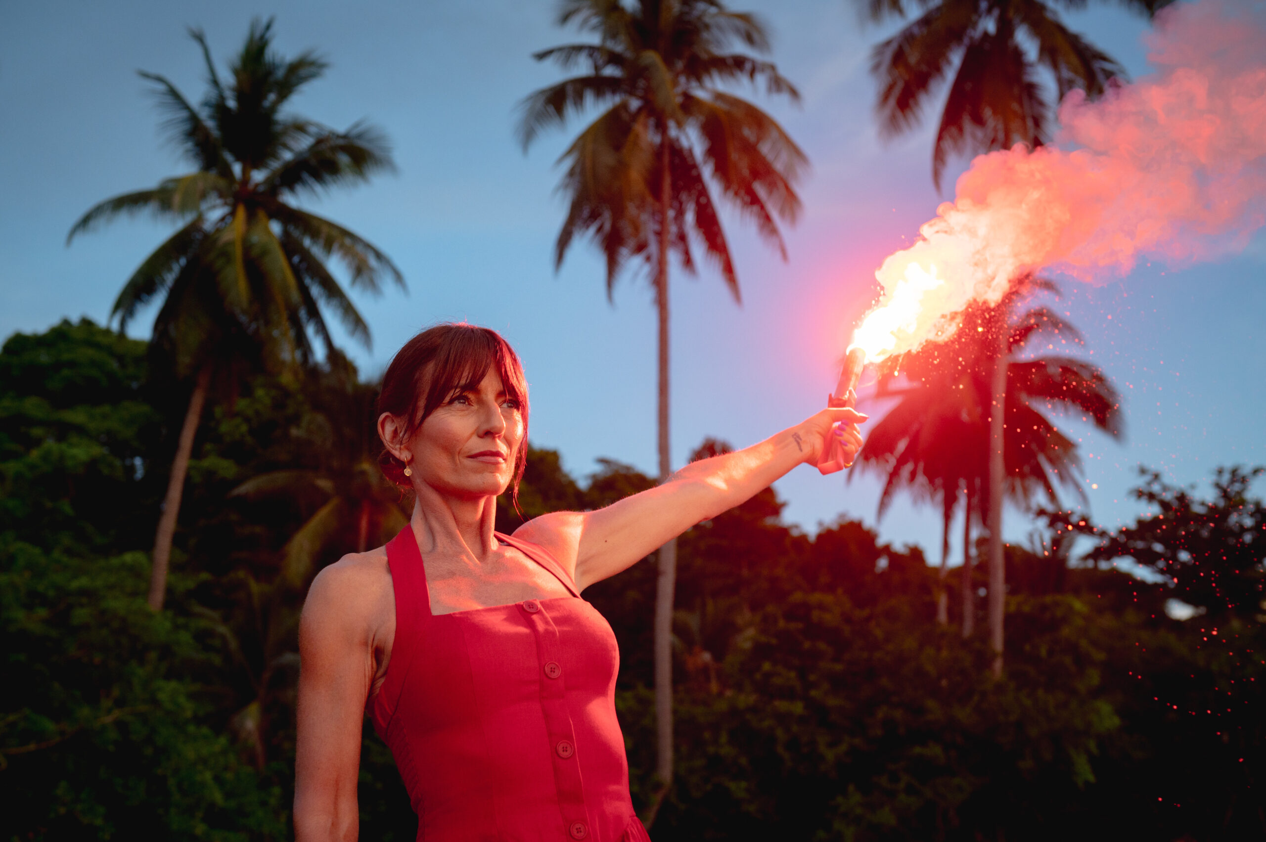 Davina McCall holding a torch light on Honeymoon Island