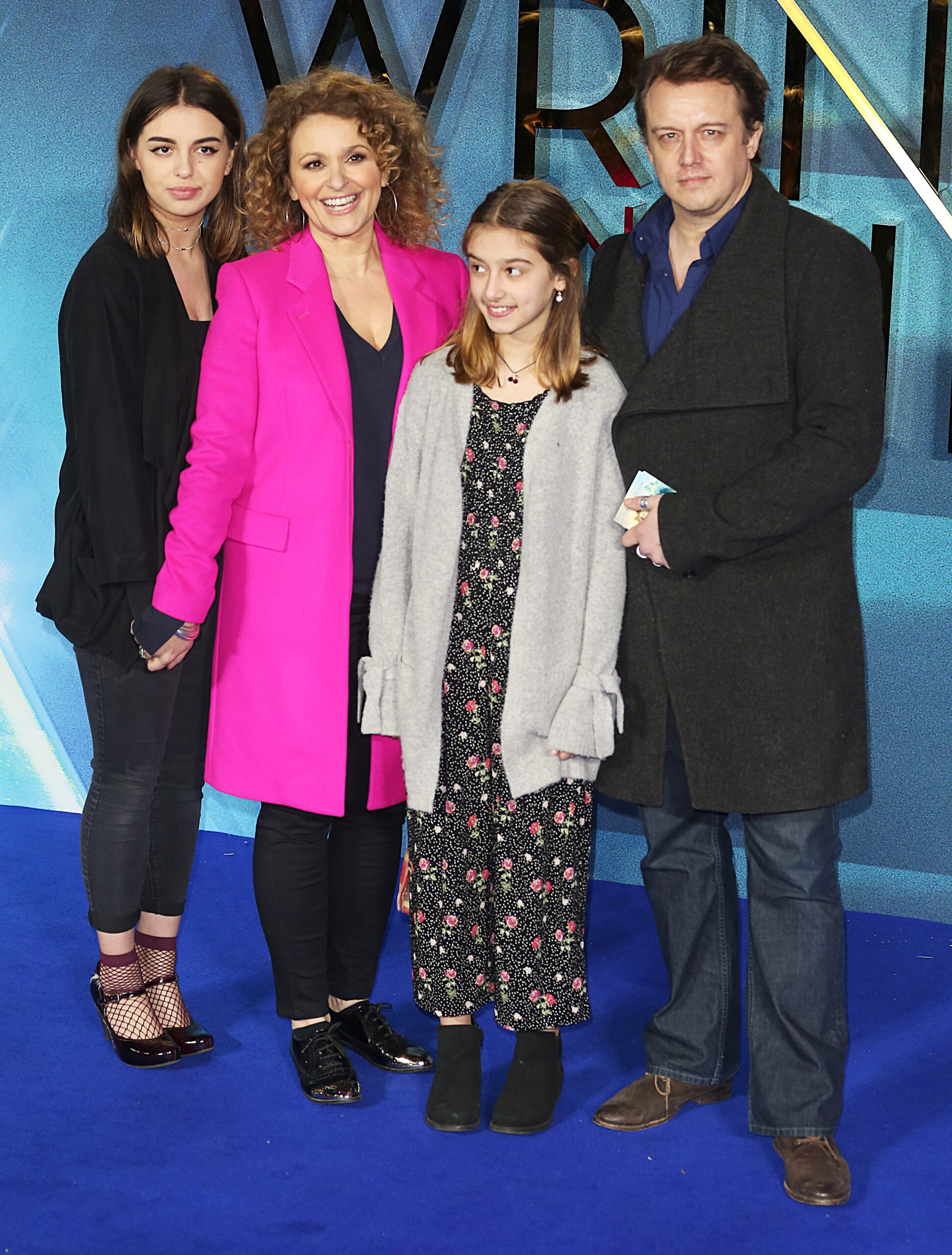 Nadia Sawalha and Mark Adderley and their two daughters on the red carpet