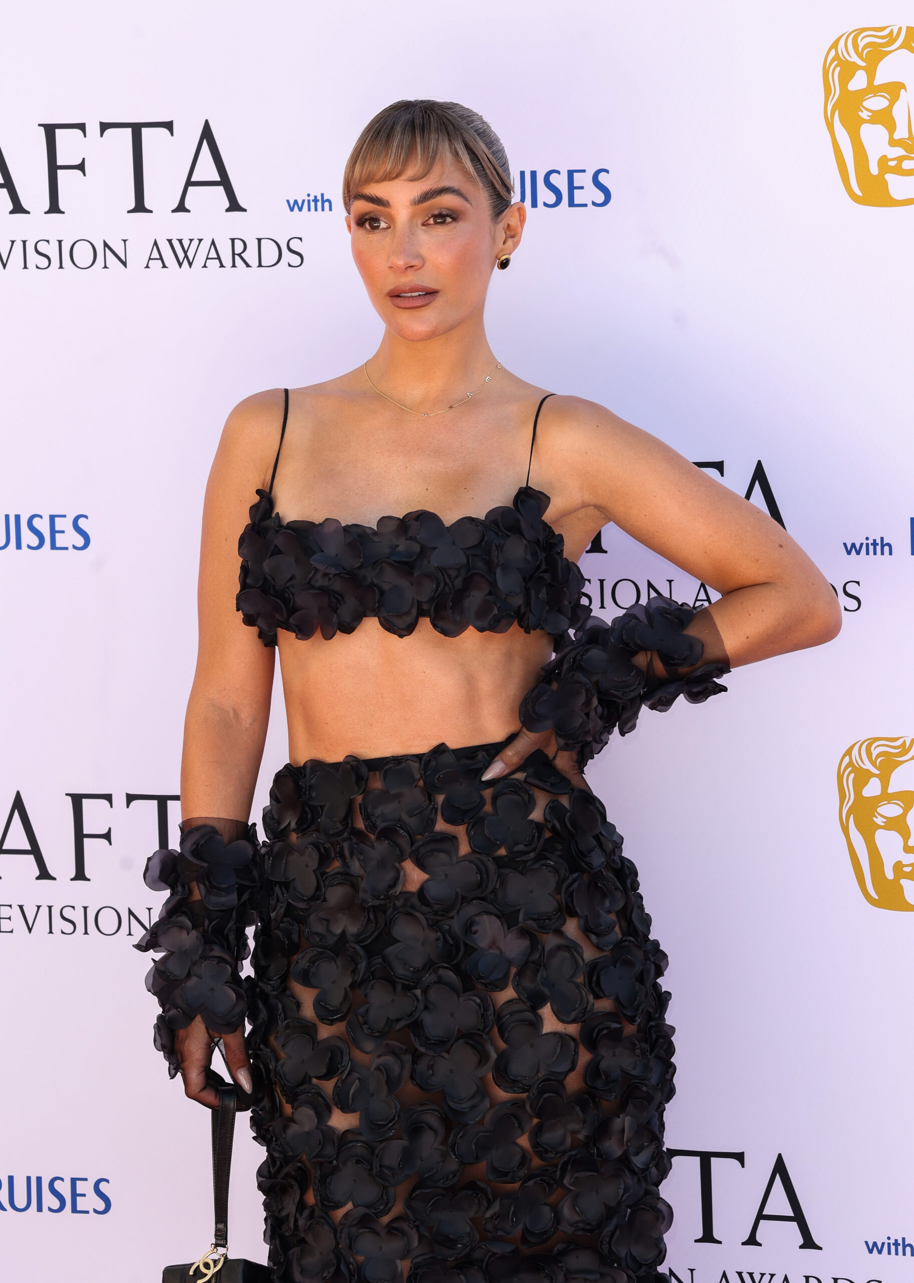 Frankie Bridge posing at the 2025 BAFTAs