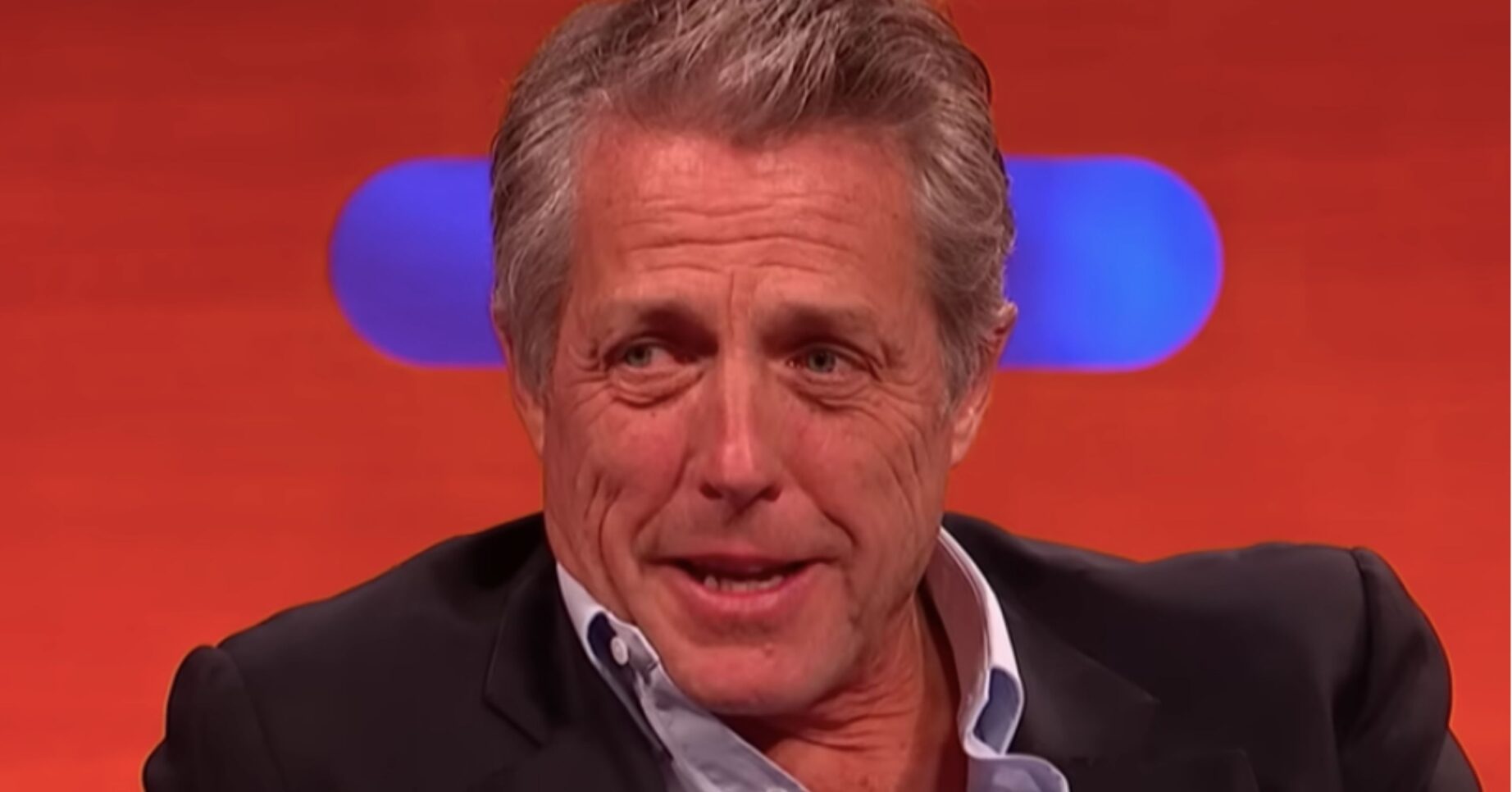 Hugh Grant looking serious