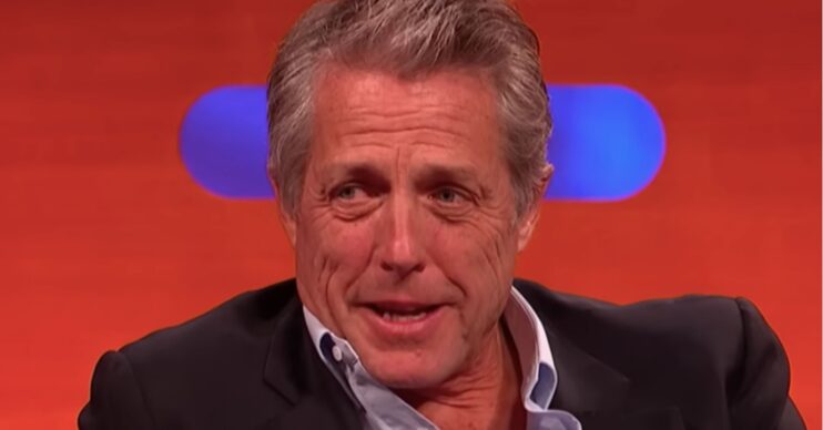 Hugh Grant looking serious