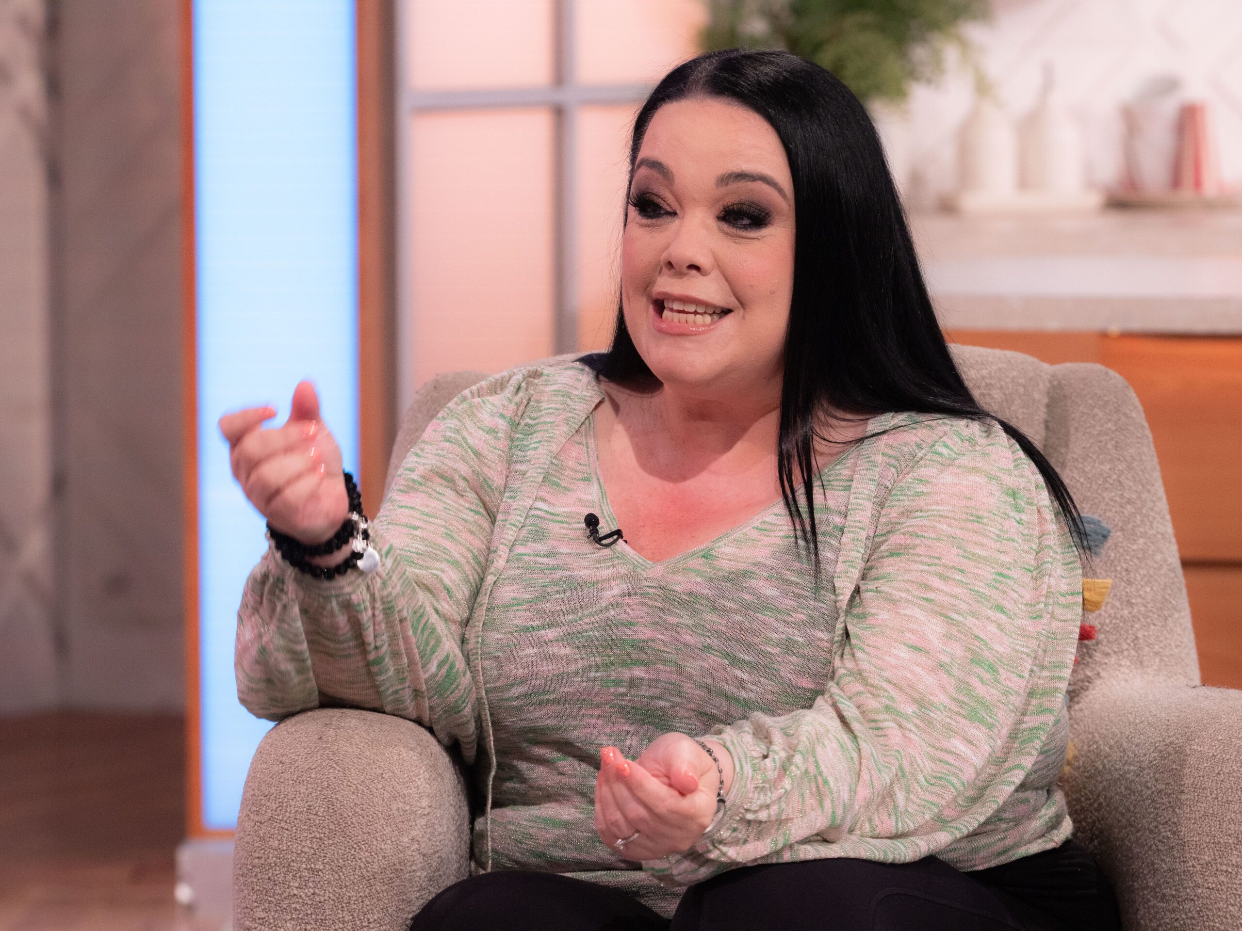 Lisa Riley speak animatedly on the show Lorraine (Credit: ITV/Shutterstock)