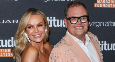Amanda Holden and Alan Carr at a red carpet event.
