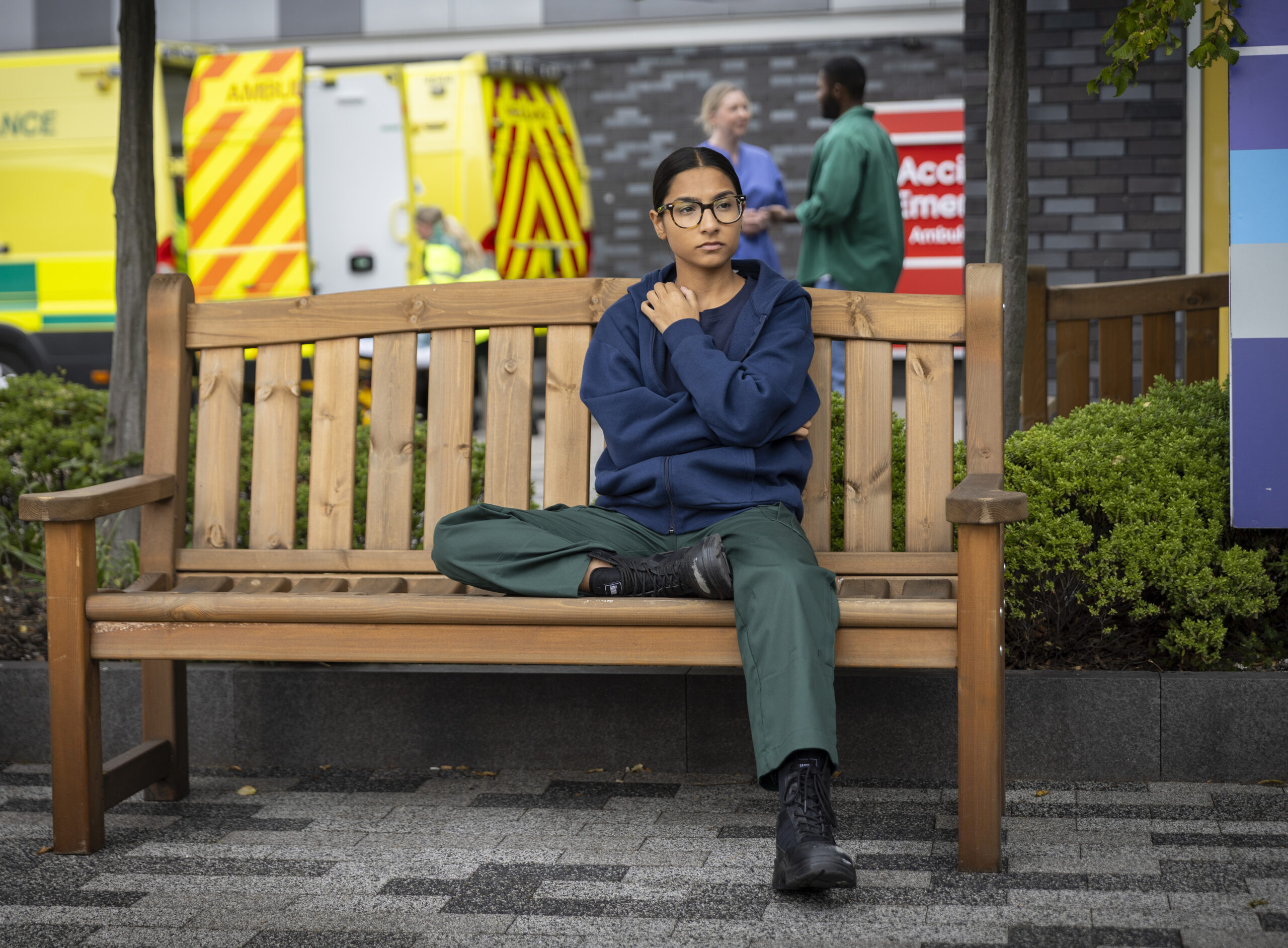 Asha sitting on bench at work