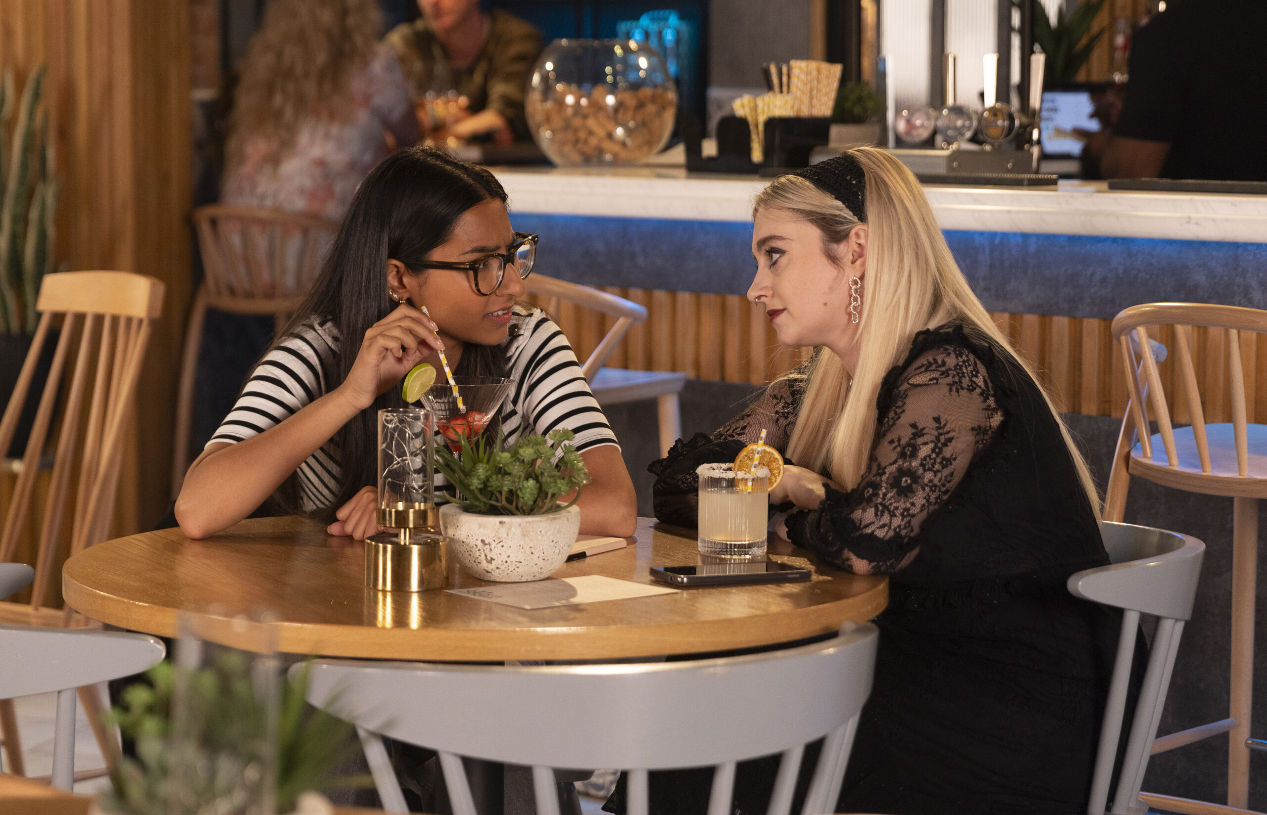 Coronation Street's Asha and Nina drinking in the Bistro