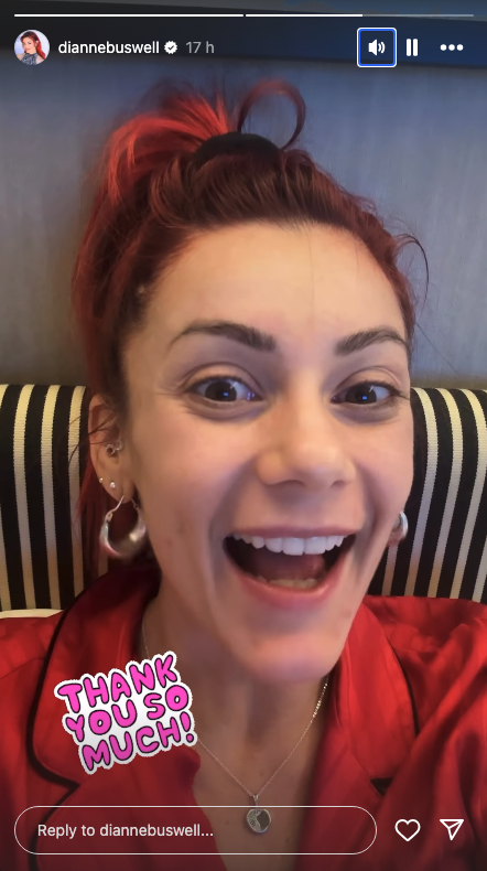 Dianne Buswell smiling in a red top