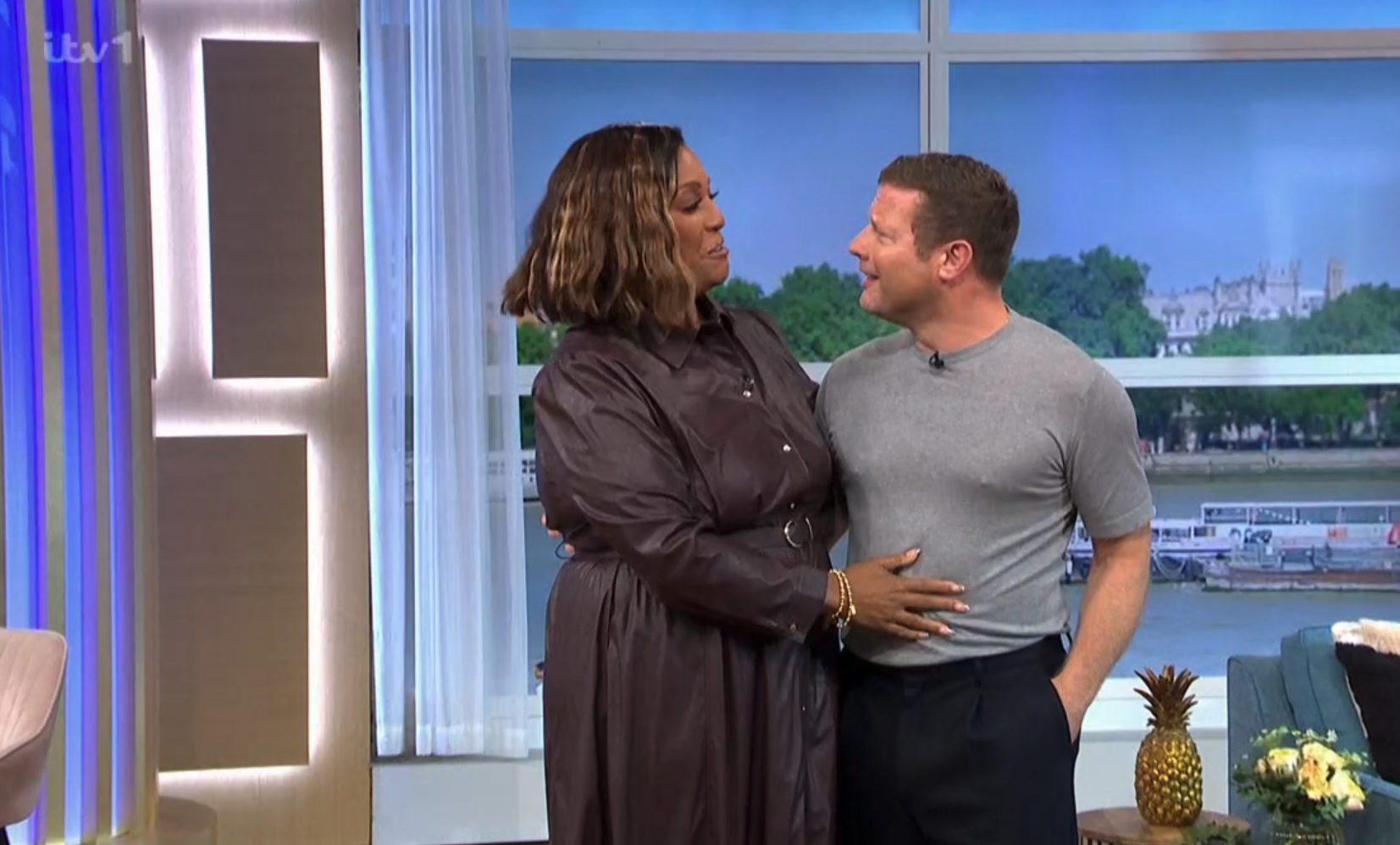 Alison Hammond in a brown dress presenting This Morning with Dermot O'Leary