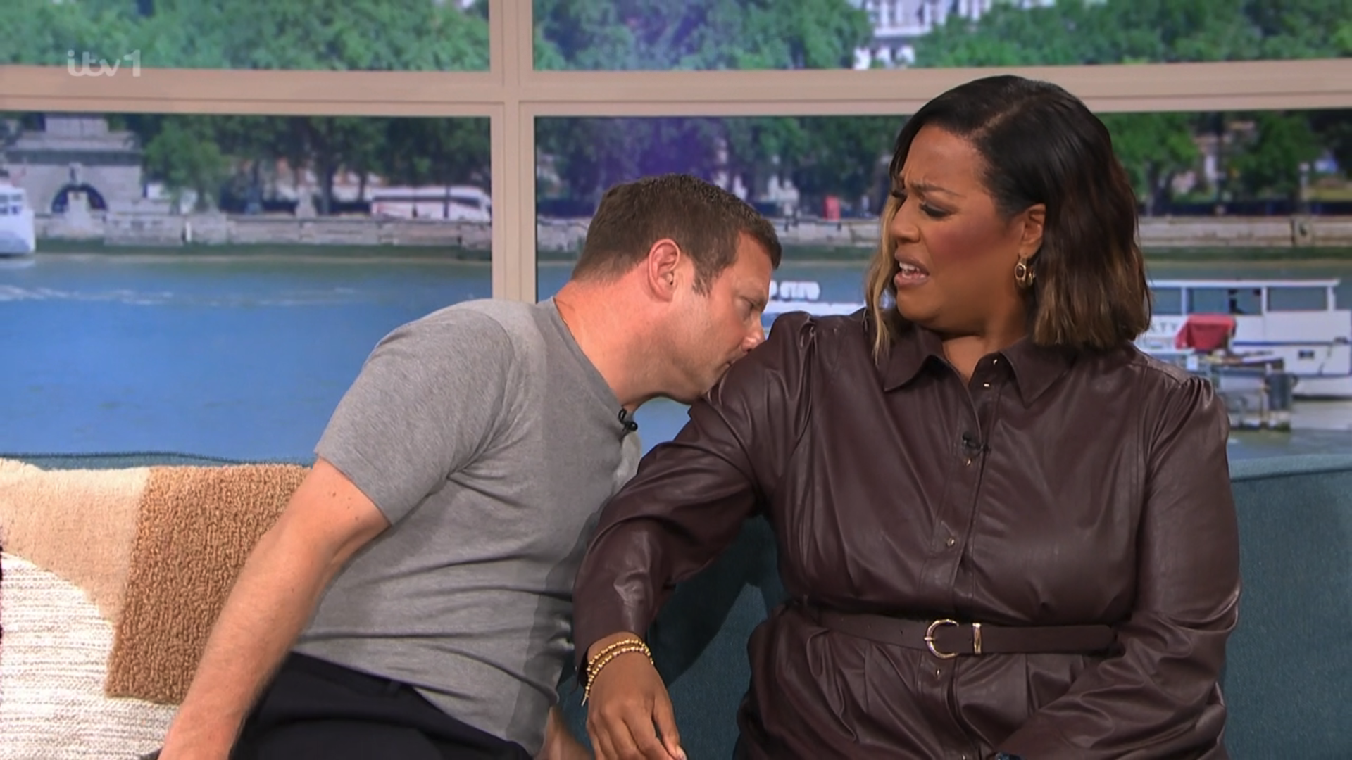 Alison Hammond in a brown dress presenting This Morning with Dermot O'Leary