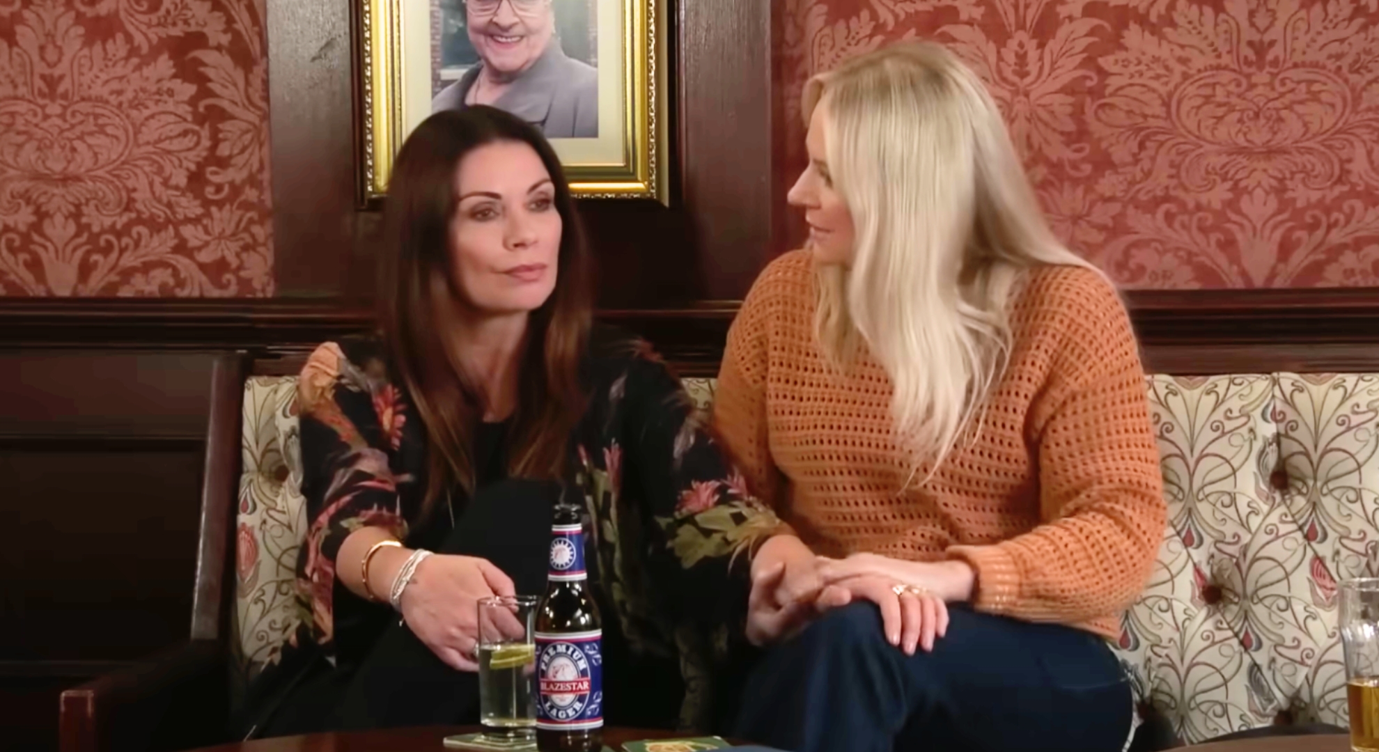 Coronation Street's Carla and Lisa holding hands in pub