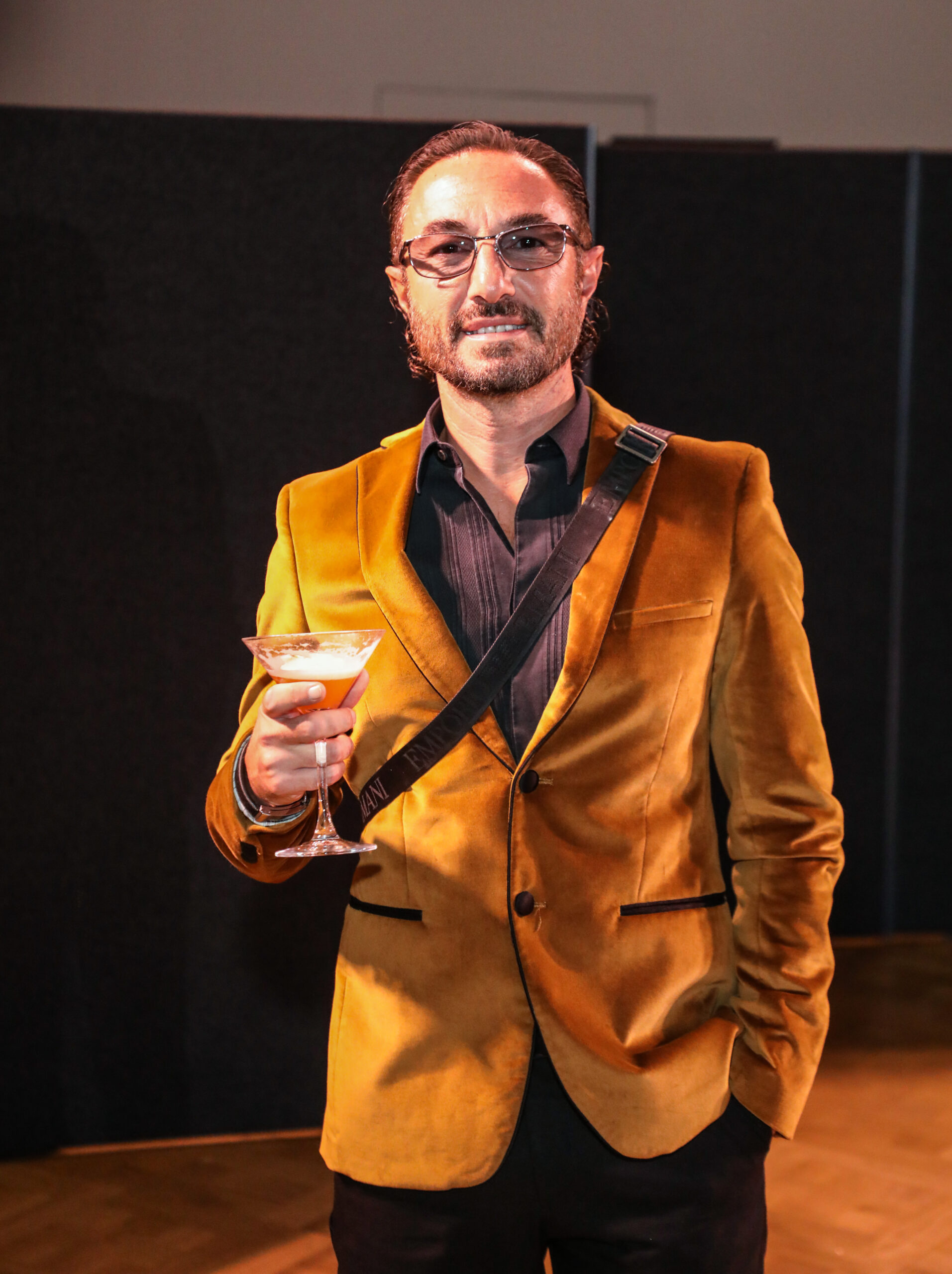 Vincent Simone in a gold jacket