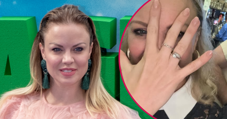 Joanne Clifton smiling and showing her engagement ring