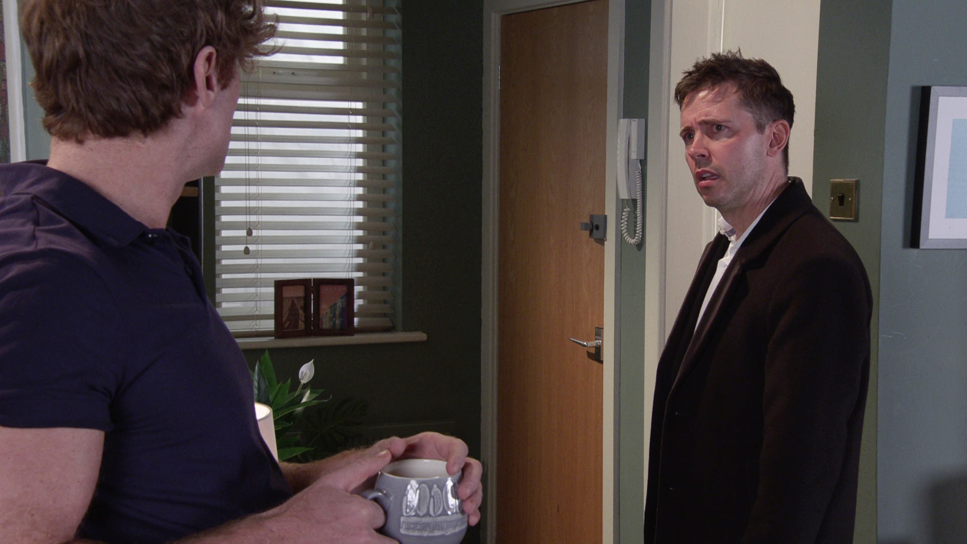 Todd looking angry at Theo in Coronation Street