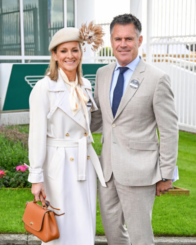 Gabby Logan and husband Kenny smiling at the races
