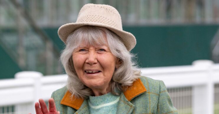 Jilly Cooper smiling in a hat