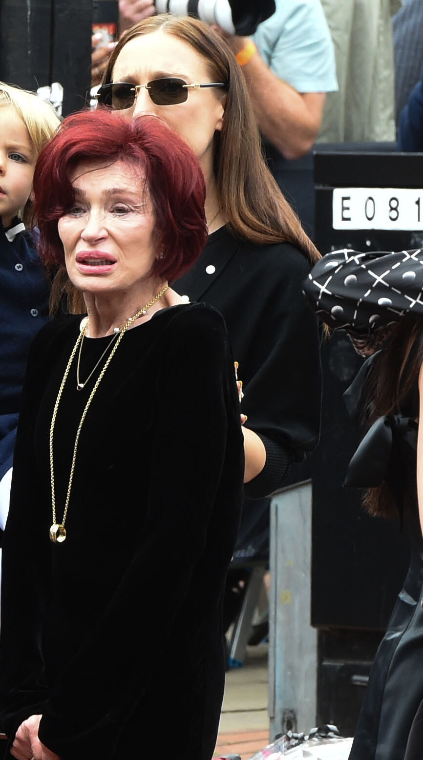 Sharon Osbourne views the tributes left by fans for her late husband Ozzy Osbourne