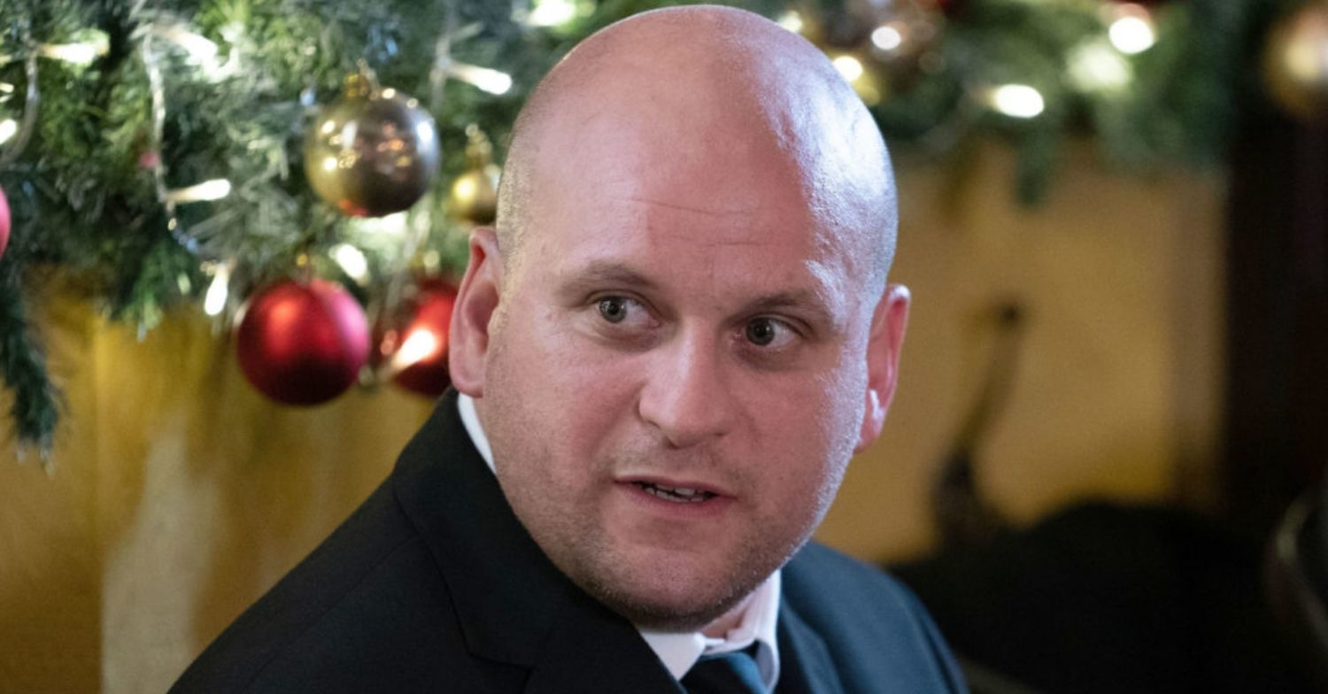 Stuart Highway on EastEnders, looking surprised at Christmas (Credit: BBC/Composite: ED!)