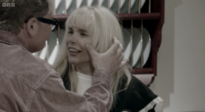 Alan Carr touching Paloma Faith's face on Celebrity Traitors