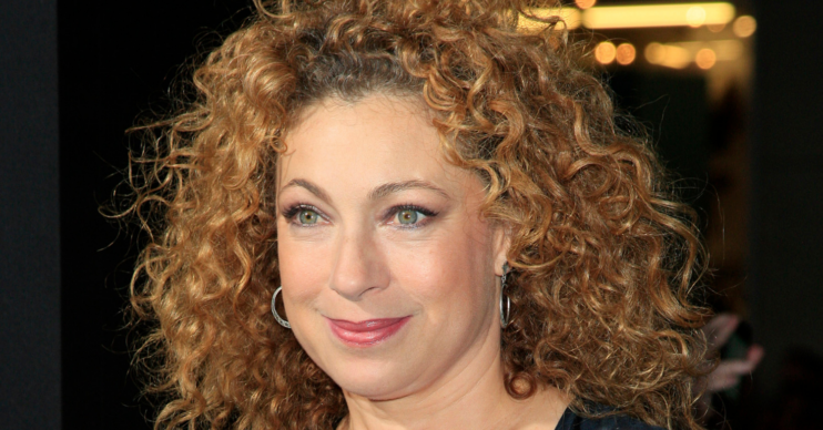 Alex Kingston wearing a black and white top