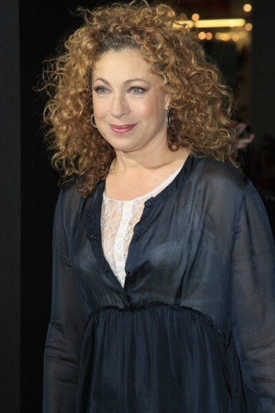 Alex Kingston wearing a black and white top