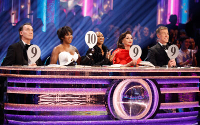 The Strictly judges holding up their paddles
