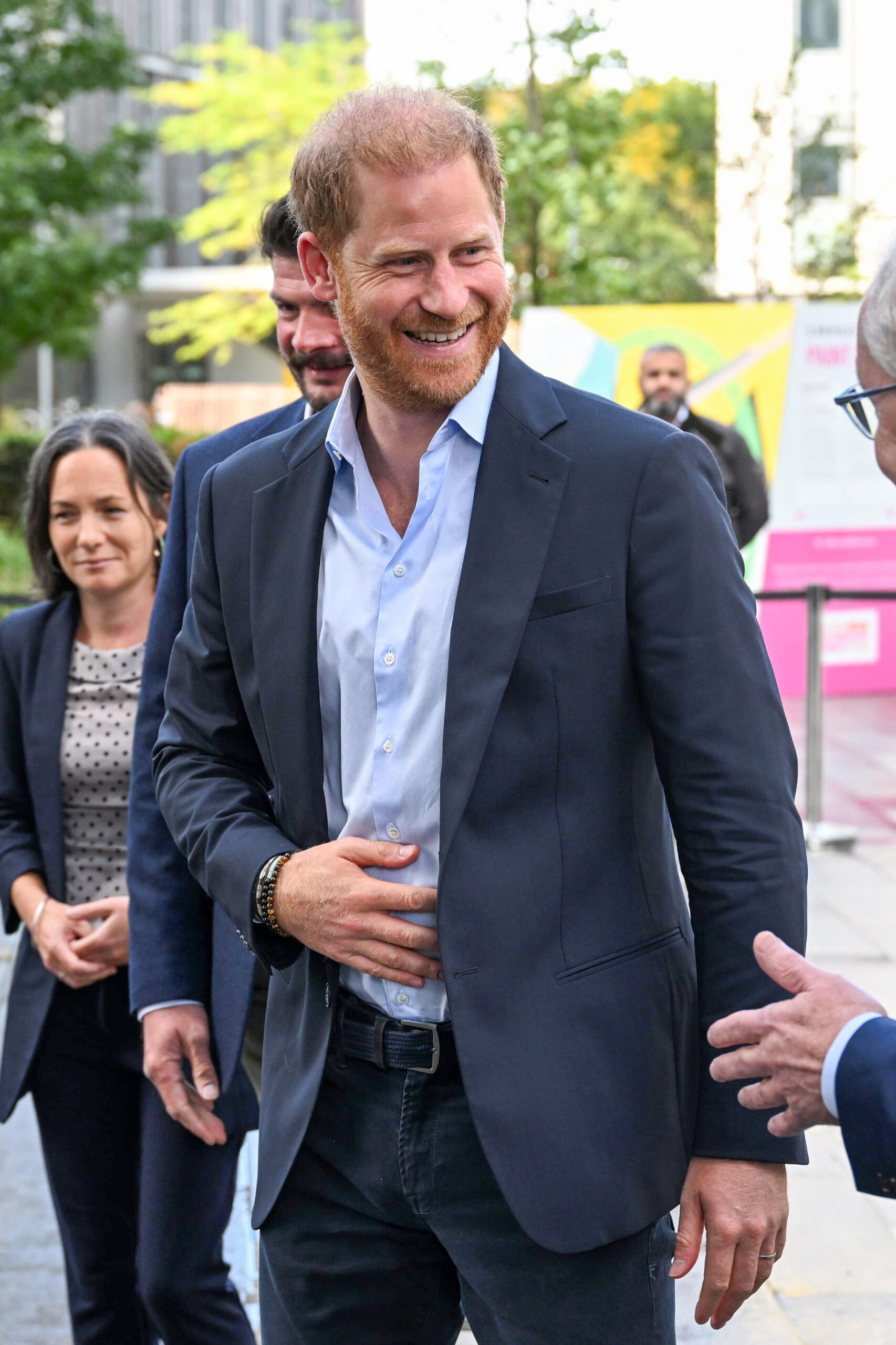 Prince Harry walking in suit