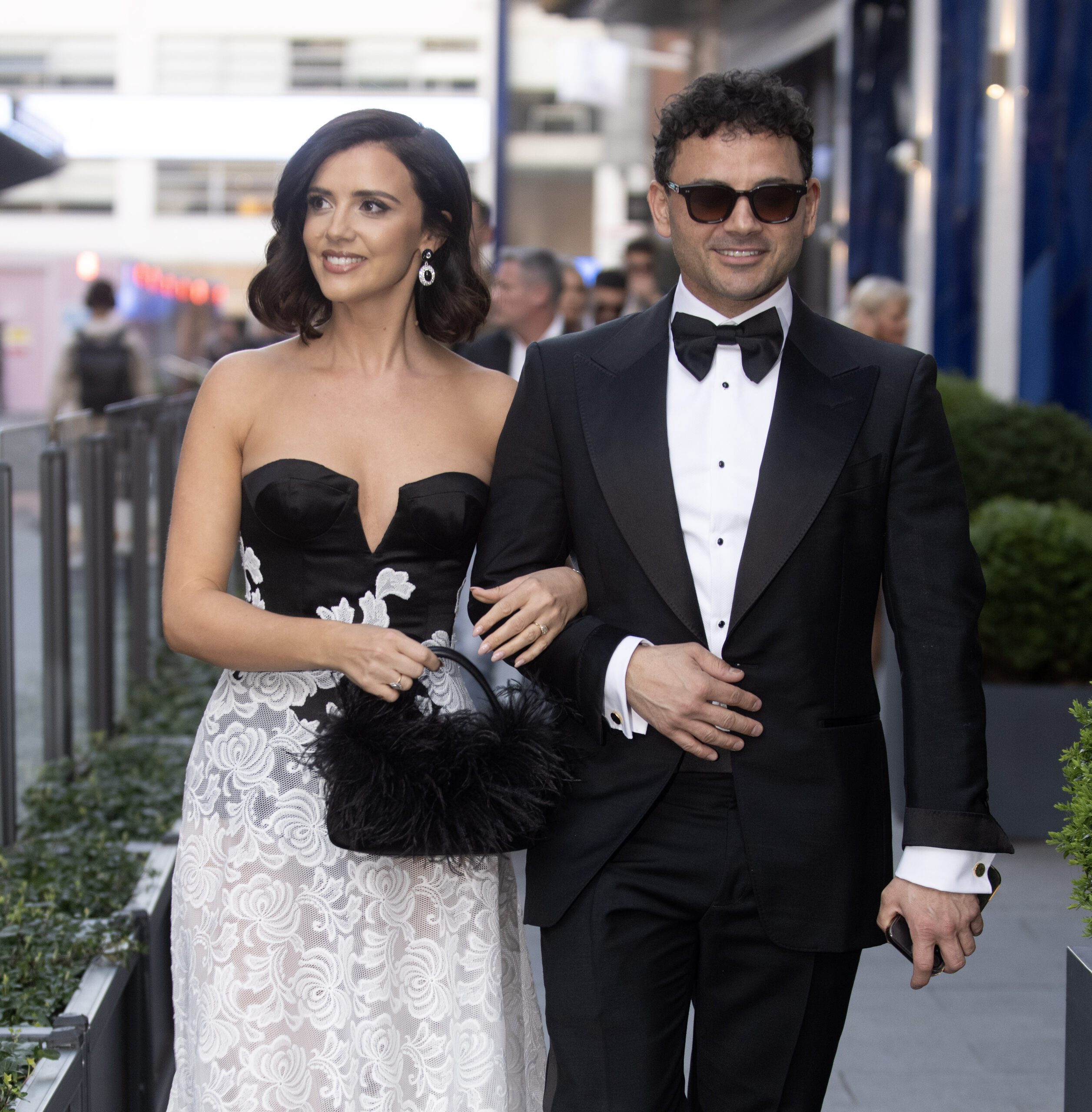Ryan Thomas and Lucy Meck arm in arm at event