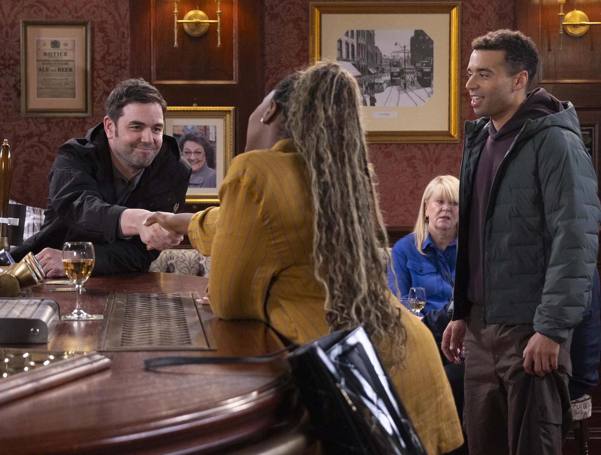 Ben, Dee-Dee and Ollie talking in the Rovers