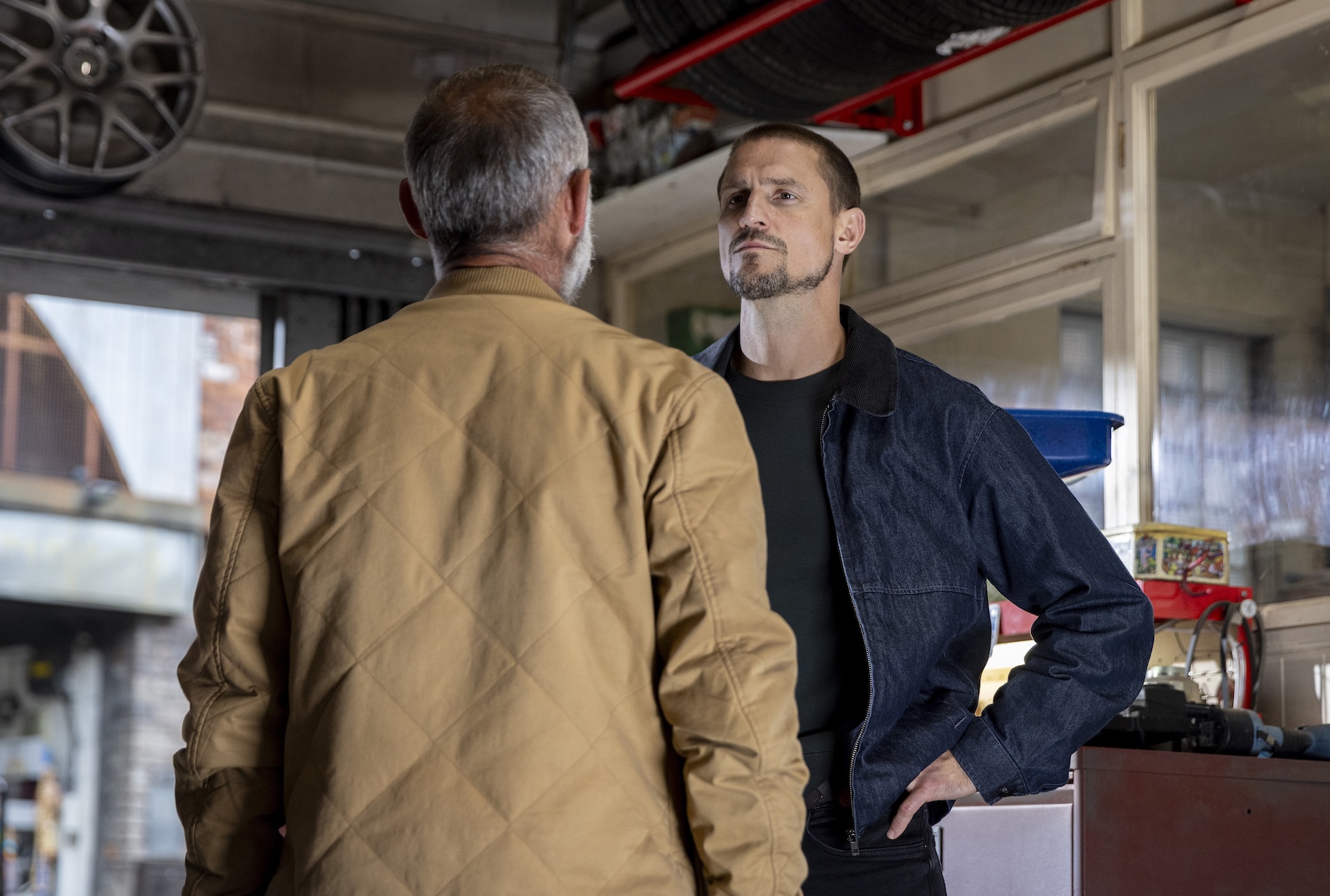 Carl and Kevin arguing at the garage in Coronation Street