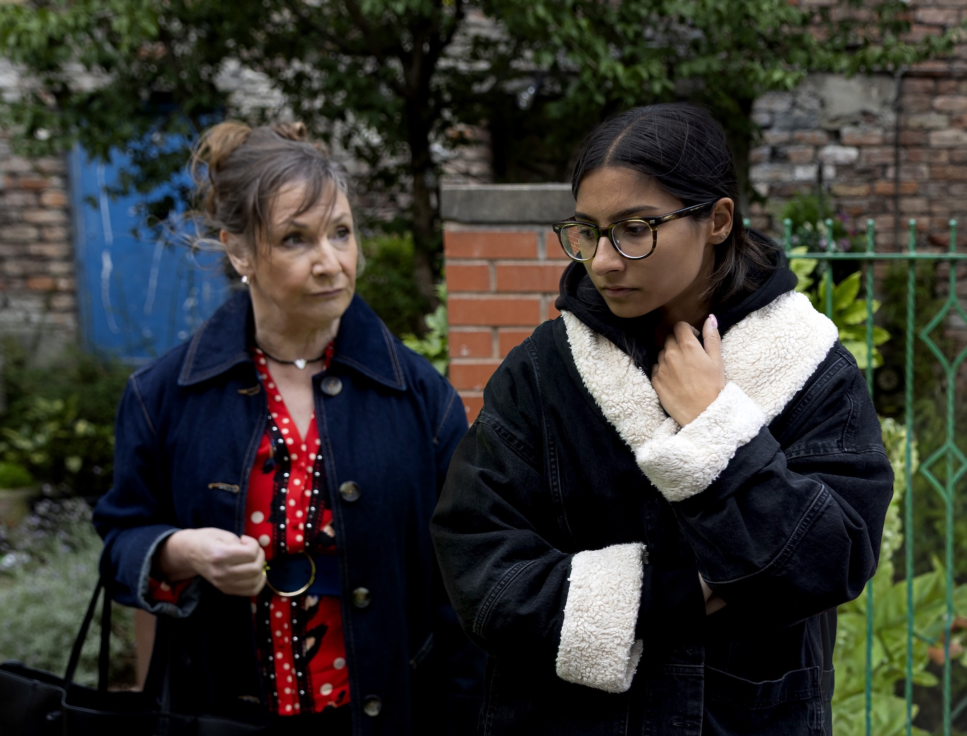 Maggie comforting upset Asha