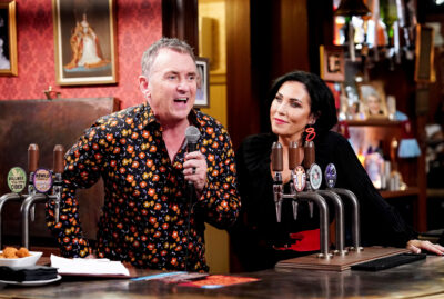 Kat looks on as Alfie leads the pub quiz at The Vic