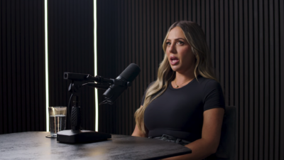 Holly Hagan speaking on a podcast