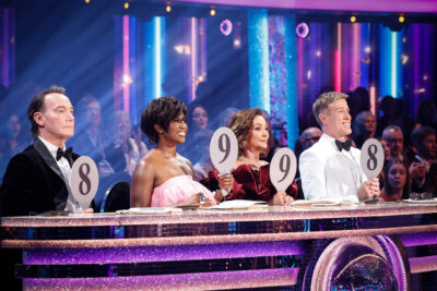 The Strictly judges holding their paddles