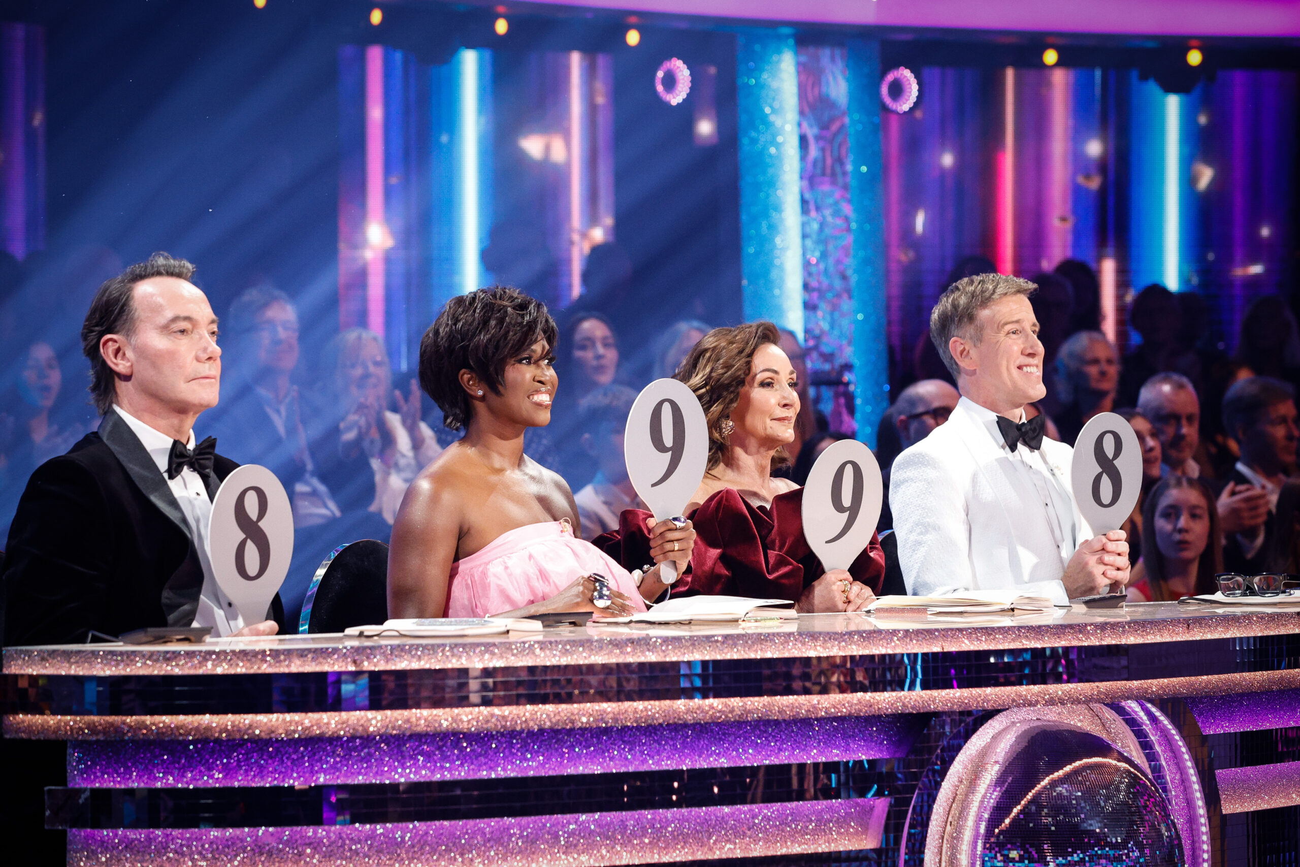 The Strictly judges holding their paddles