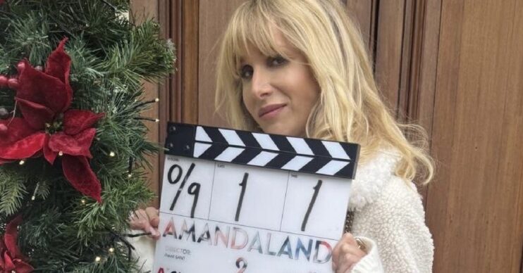 Lucy Punch with clapperboard for Amandaland Christmas Special
