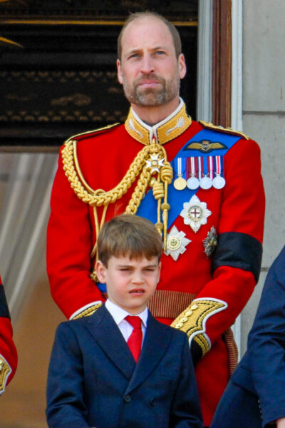 Prince William and Prince Louis standing on the balcony of Buckingham Palace