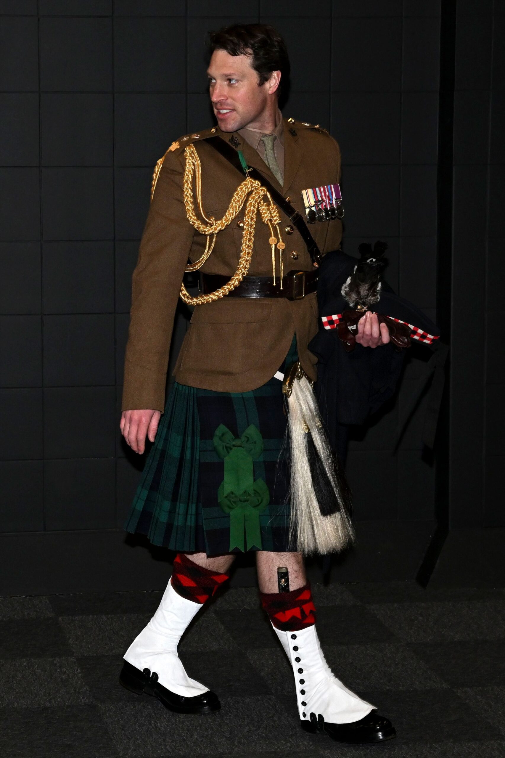 Lieutenant Colonel Johnny Thompson wearing his uniform and and a kilt