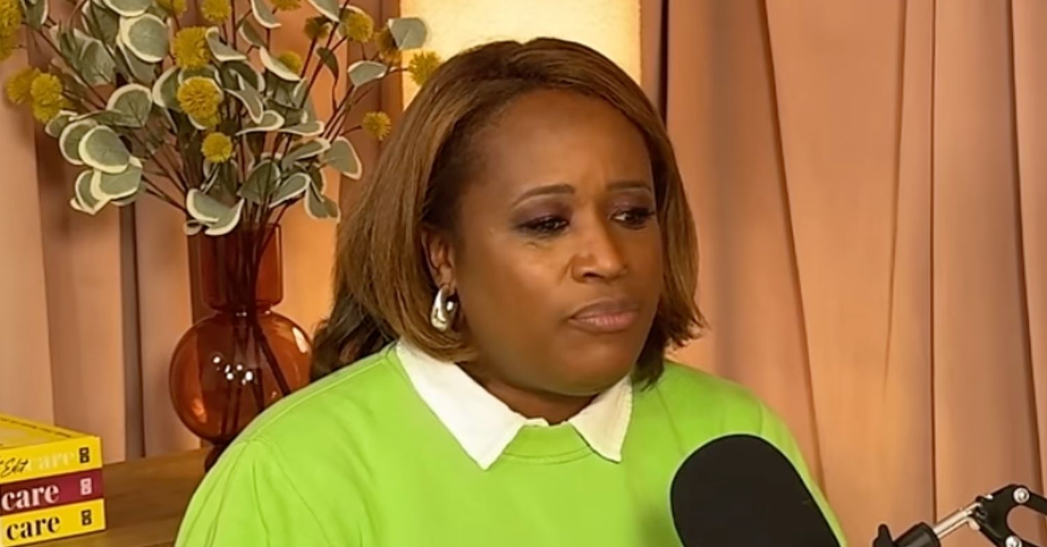 Charlene White on podcast in green jumper