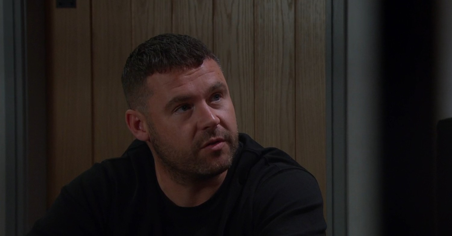 Aaron looks annoyed as he talks to Robert