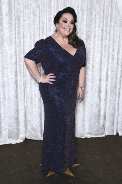 Lisa Riley in a black dress