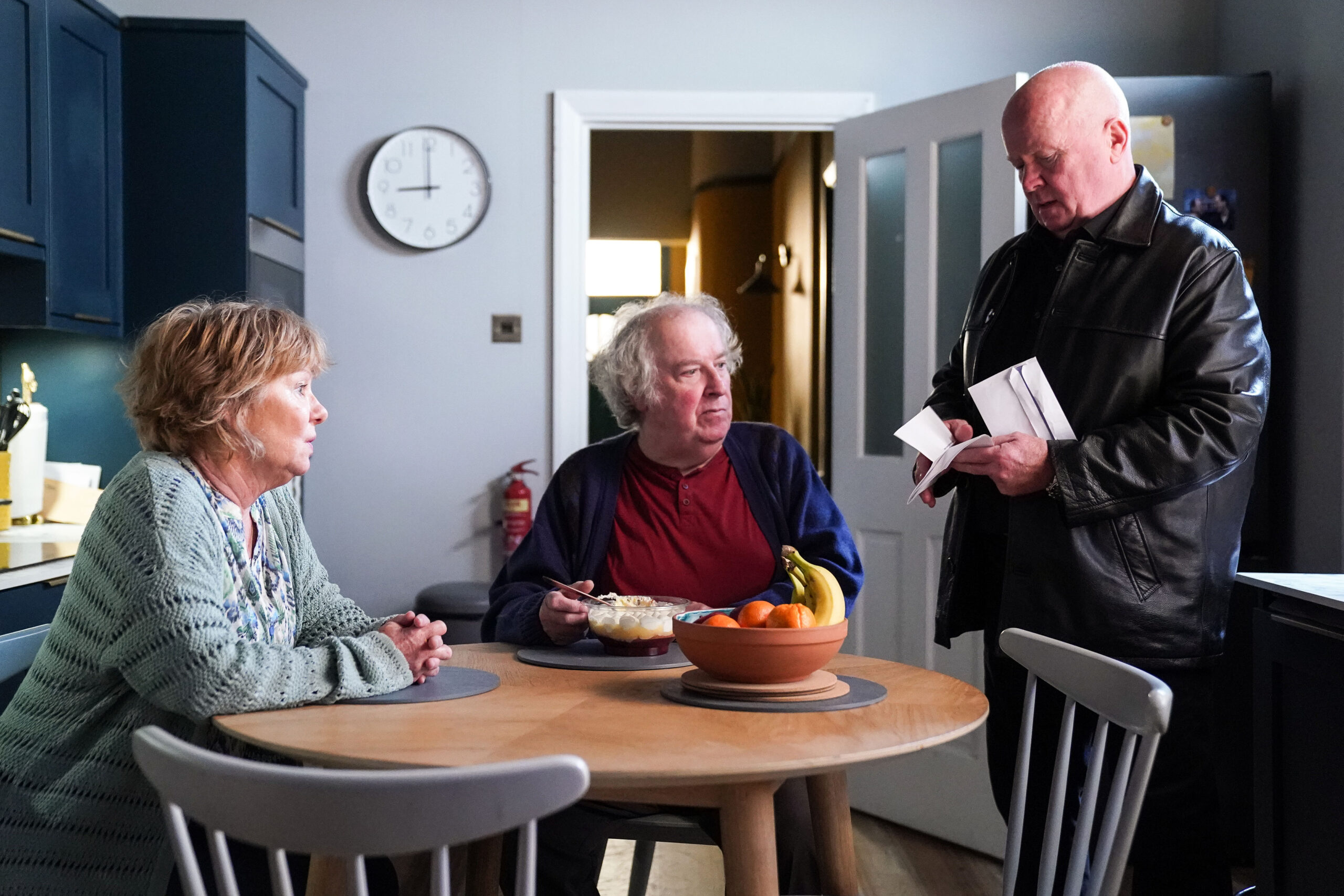Phil talks to Julie and Nigel in the kitchen