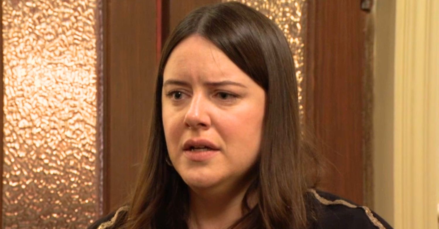 Zoe looks worried in EastEnders (Credit: BBC/Composite: ED!)