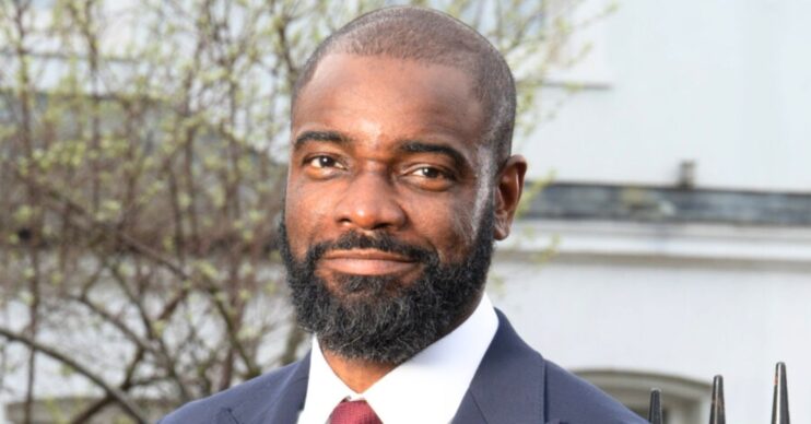 Junior smiling in an EastEnders publicity picture (Credit: BBC/Composite: ED!)