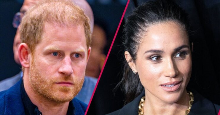 Prince Harry frowning beside Meghan Markle with a shocked expression