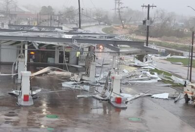 The image shows a gas station damaged by the Hurricane Melissa in Montego Bay, Jamaica.