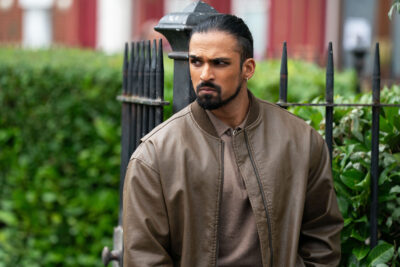 Ravi looks angry in EastEnders
