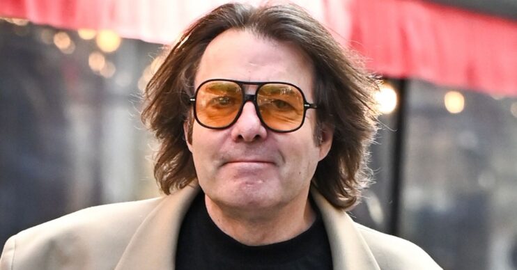 Jonathan Ross walking in sunglasses
