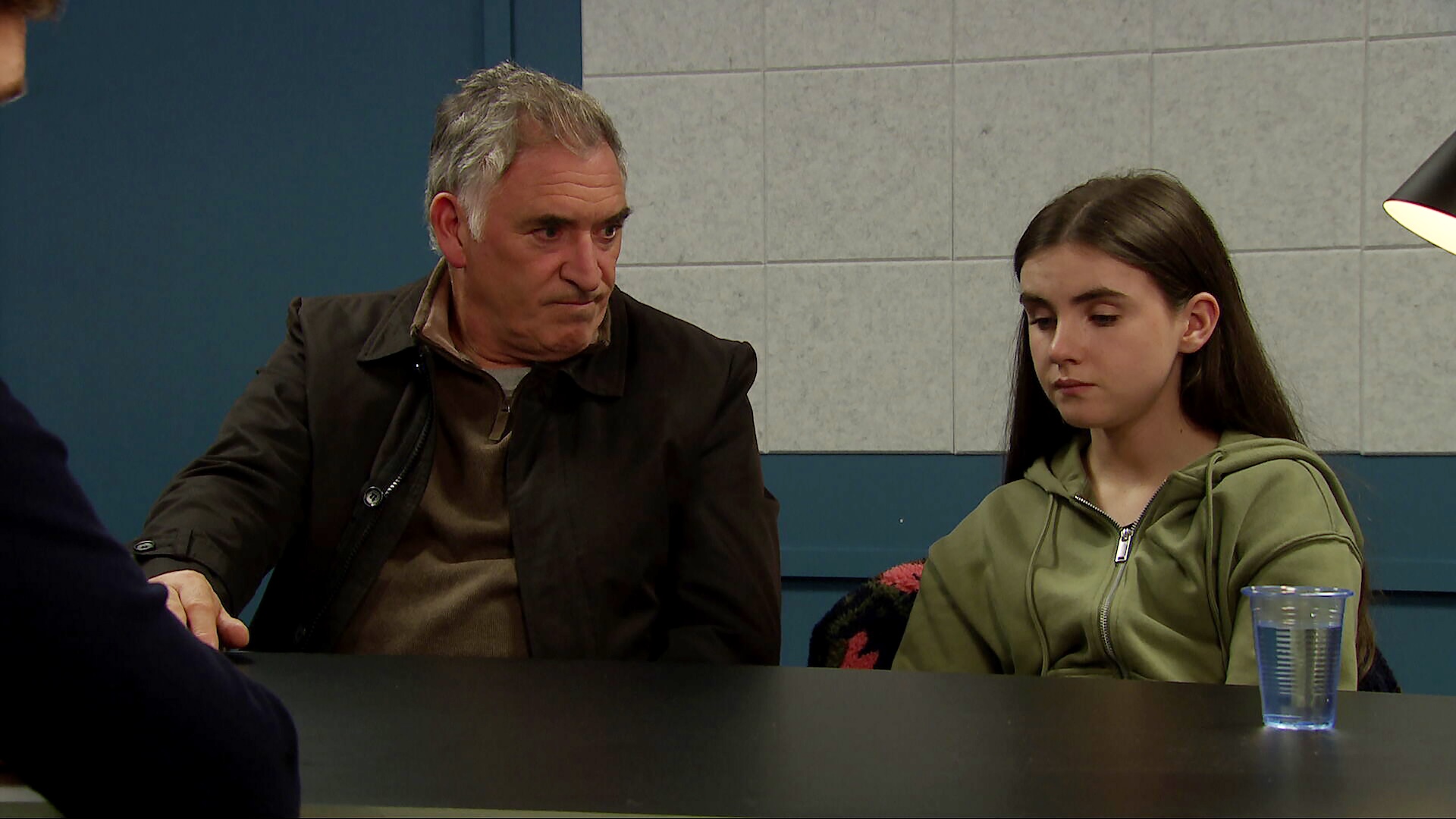 Bob sits with April in the police station in Emmerdale