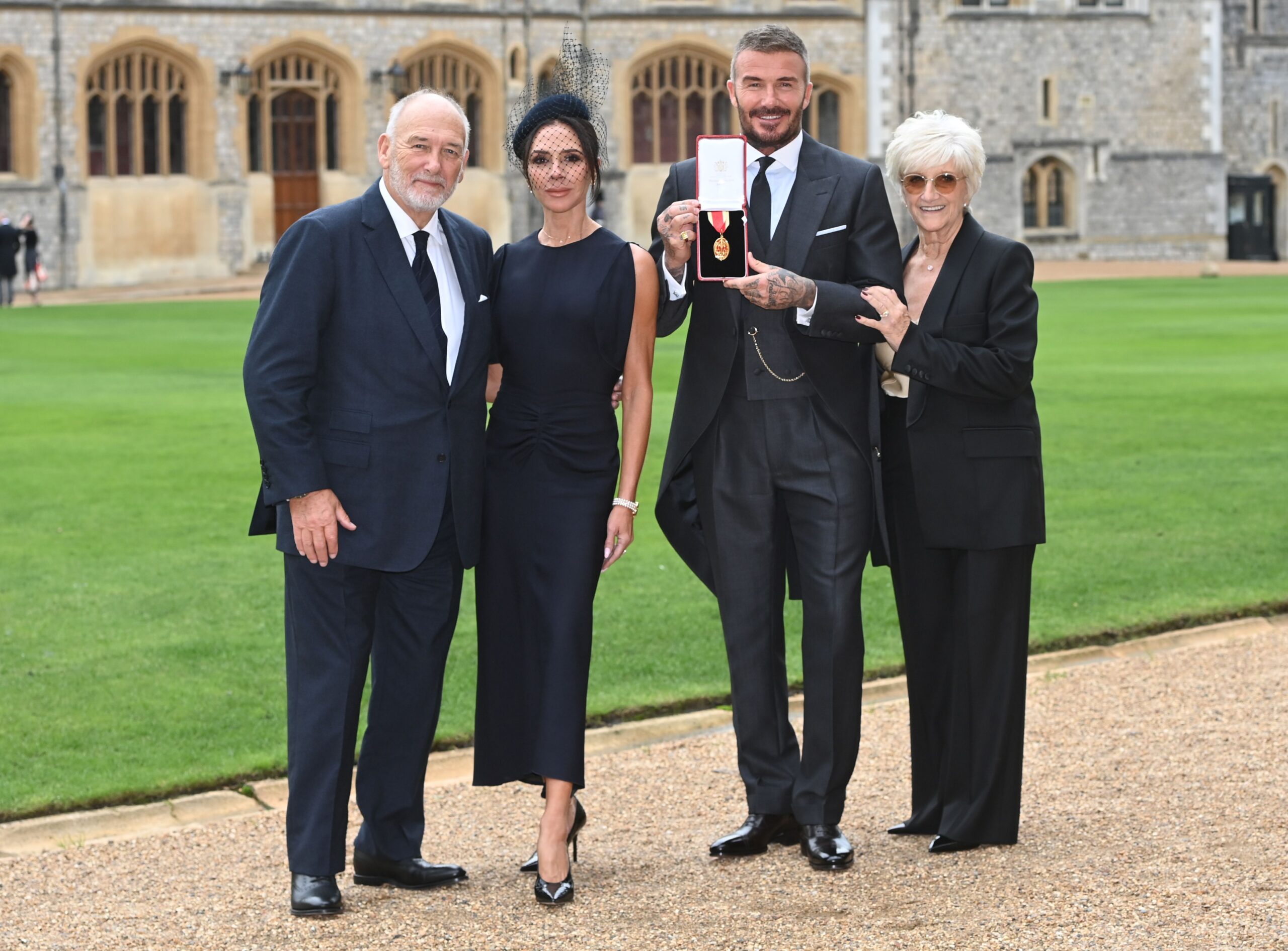 David Beckham with Victoria and his parents after receiving knighthood