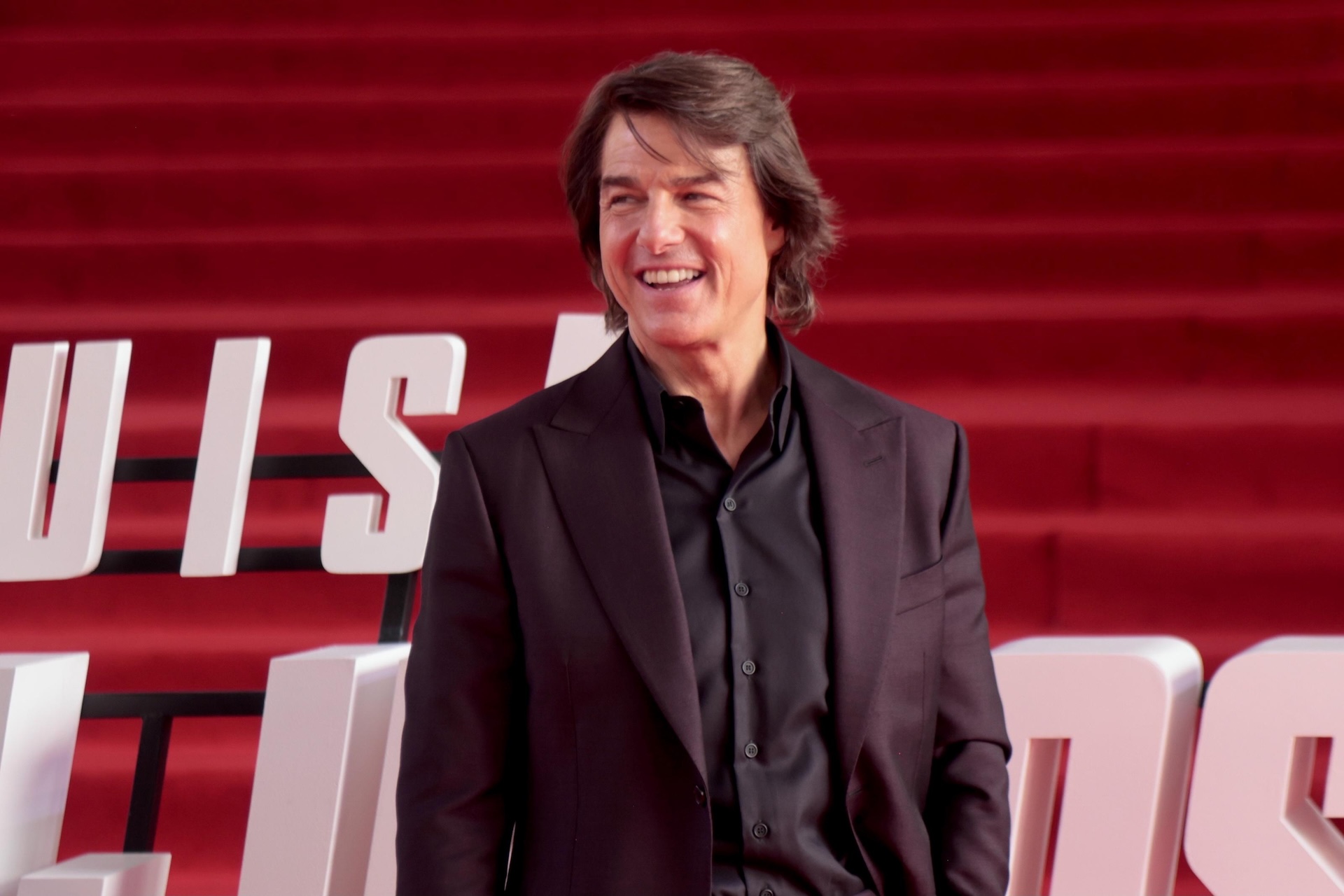 Tom Cruise at event smiling