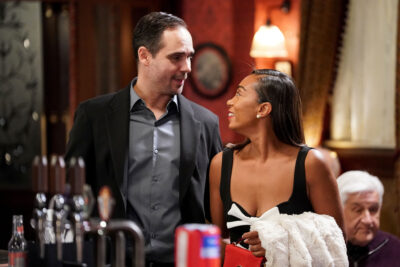 Chelsea flirting with a man in The Vic